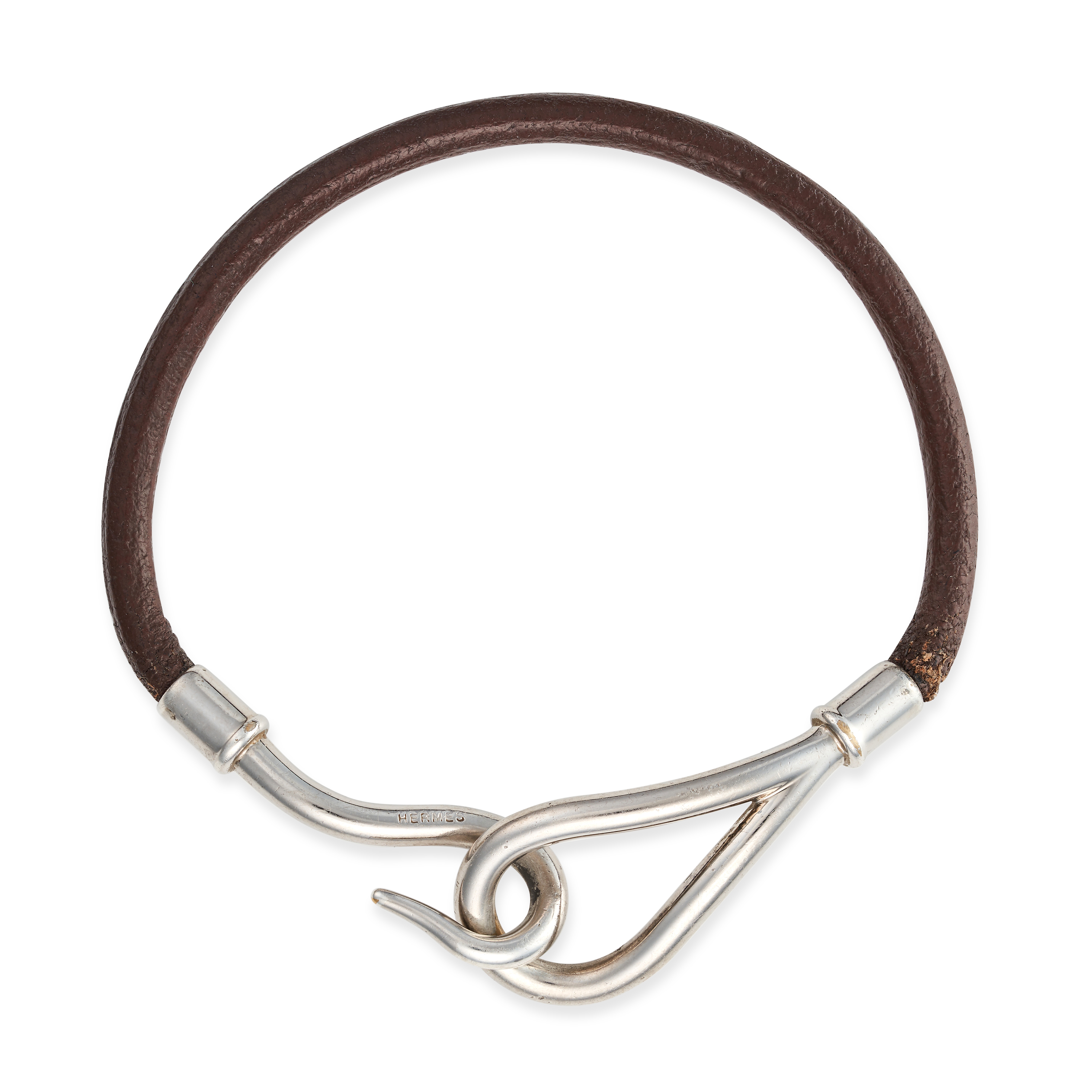 HERMES, A LEATHER BRACELET the leather strap with a hook clasp, signed Hermes, no assay marks, 19...