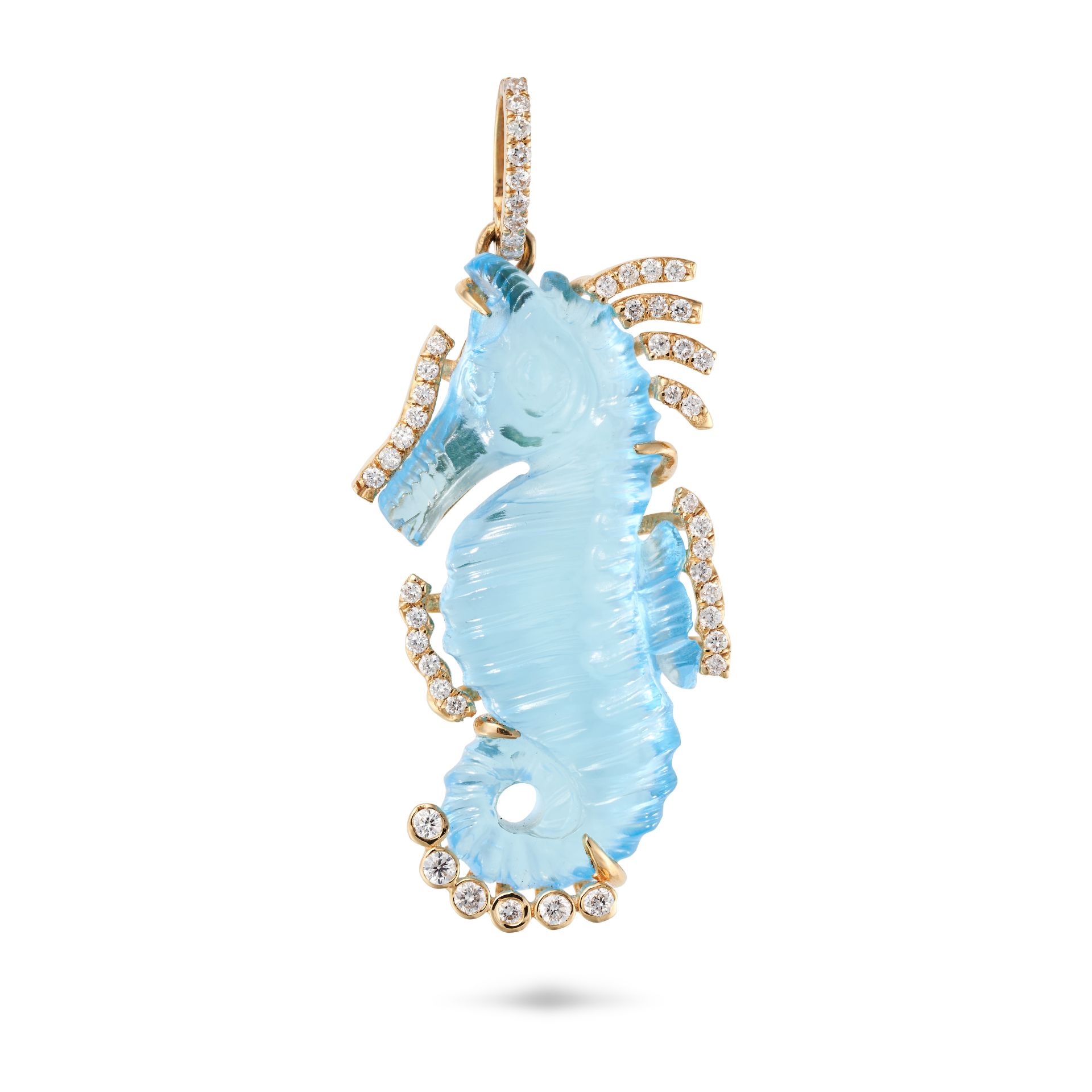 A BLUE TOPAZ AND DIAMOND SEAHORSE PENDANT set with a blue topaz carved to depict a seahorse accen...