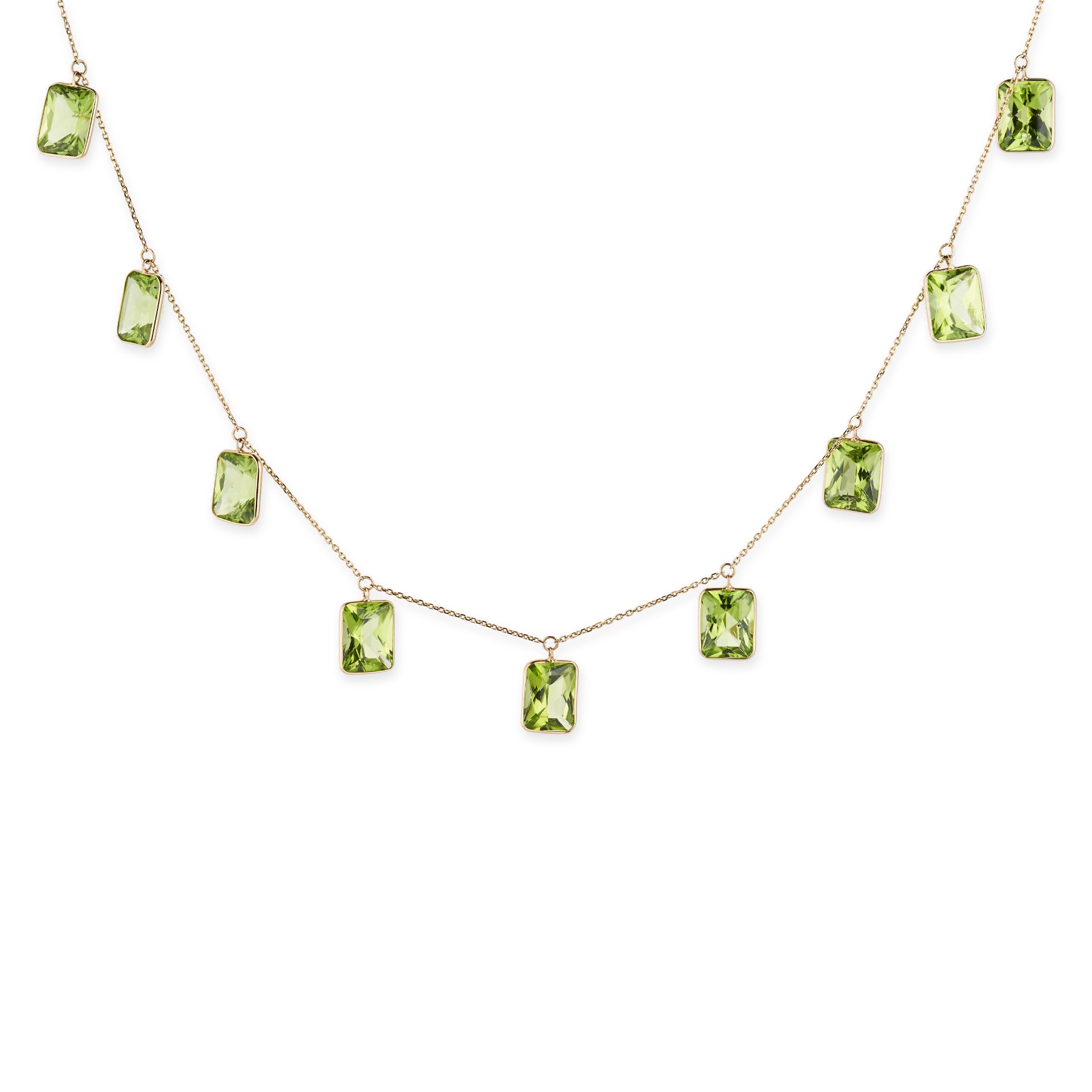 A PERIDOT FRINGE NECKLACE comprising a trace chain suspending nine fancy cut peridot pendants, st...