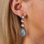 A PAIR OF AQUAMARINE, RAINBOW MOONSTONE AND DIAMOND DROP EARRINGS each comprising three round cab...