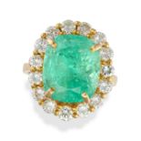 A COLOMBIAN EMERALD AND DIAMOND CLUSTER RING set with a cushion cut emerald of approximately 8.75...