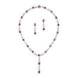 A BURMESE RUBY AND DIAMOND NECKLACE AND EARRINGS SUITE the necklace set with a row of oval cut ru...