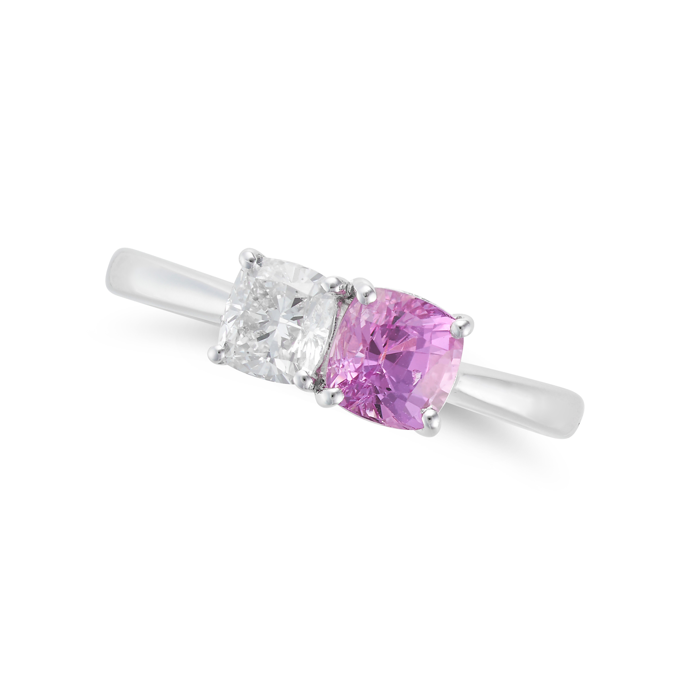 A PINK SAPPHIRE AND DIAMOND RING in platinum, set with a cushion cut pink sapphire of 1.03 carats...