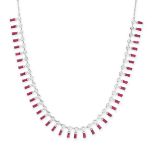 A RUBY AND DIAMOND FRINGE NECKLACE comprising a row of round brilliant cut diamonds suspending a ...