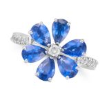A SAPPHIRE AND DIAMOND FLOWER RING in 18ct white gold, set with a round brilliant cut diamond in ...