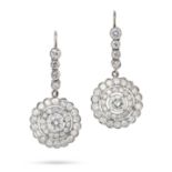 A PAIR OF DIAMOND CLUSTER DROP EARRINGS each comprising a row of round cut diamonds, suspending a...