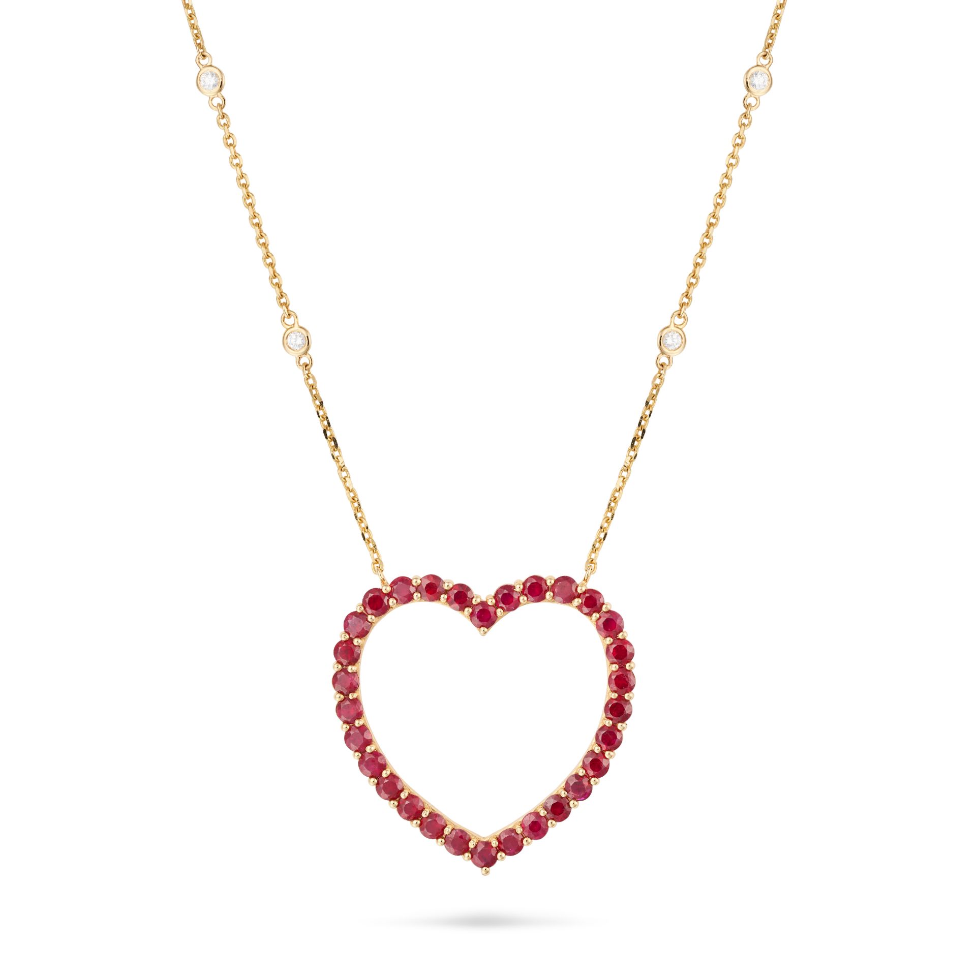 A RUBY AND DIAMOND HEART PENDANT NECKLACE the pendant designed as an openwork heart set with roun...