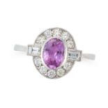 A PINK SAPPHIRE AND DIAMOND CLUSTER RING set with an oval cut pink in a border of round brilliant...