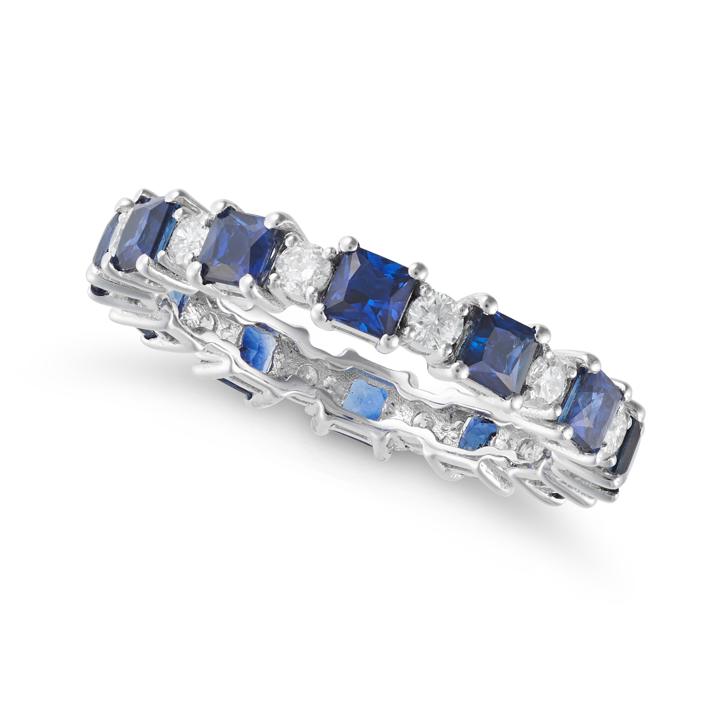 A SAPPHIRE AND DIAMOND ETERNITY RING in 18ct white gold, set all around with a row of alternating...