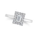 A DIAMOND RING in platinum, set with a baguette cut diamond in a border of round brilliant cut di...