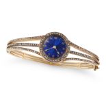 AN ANTIQUE DIAMOND WATCH BANGLE in yellow gold, the circular dial decorated with blue guilloche e...