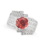 A PINK TOURMALINE AND DIAMOND DRESS RING set with a round cut pink tourmaline accented by round b...
