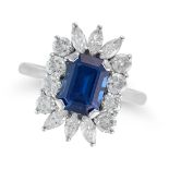 A SAPPHIRE AND DIAMOND CLUSTER RING set with an octagonal step cut sapphire of approximately 2.80...