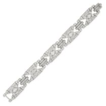 CARTIER, AN ART DECO DIAMOND BRACELET in platinum, comprising a row of five openwork geometric li...