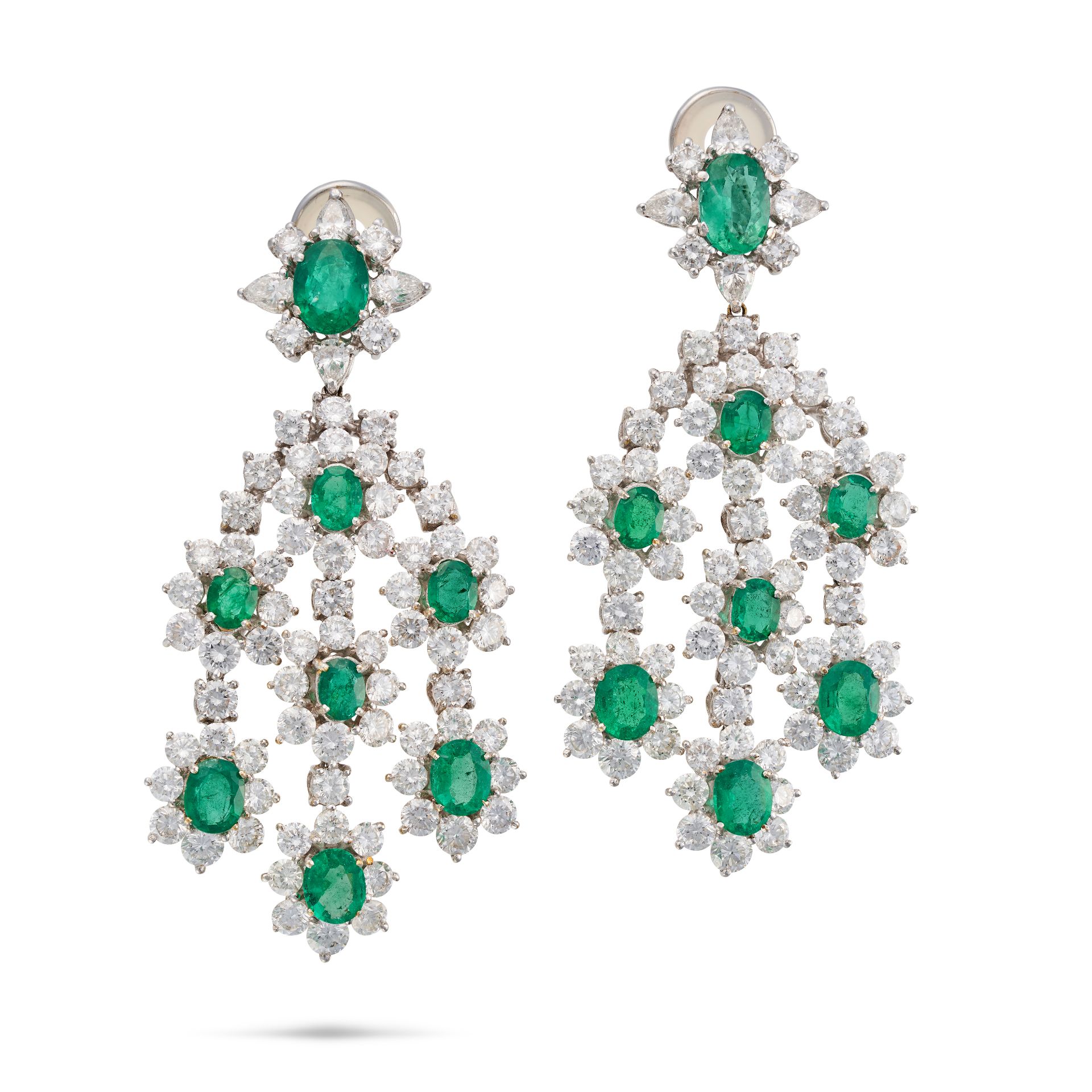 A PAIR OF EMERALD AND DIAMOND DROP EARRINGS each set with an oval cut emerald in a cluster of rou...