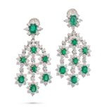 A PAIR OF EMERALD AND DIAMOND DROP EARRINGS each set with an oval cut emerald in a cluster of rou...