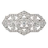 A FRENCH DIAMOND PLAQUE  BROOCH in platinum, the openwork geometric brooch set to the centre with...