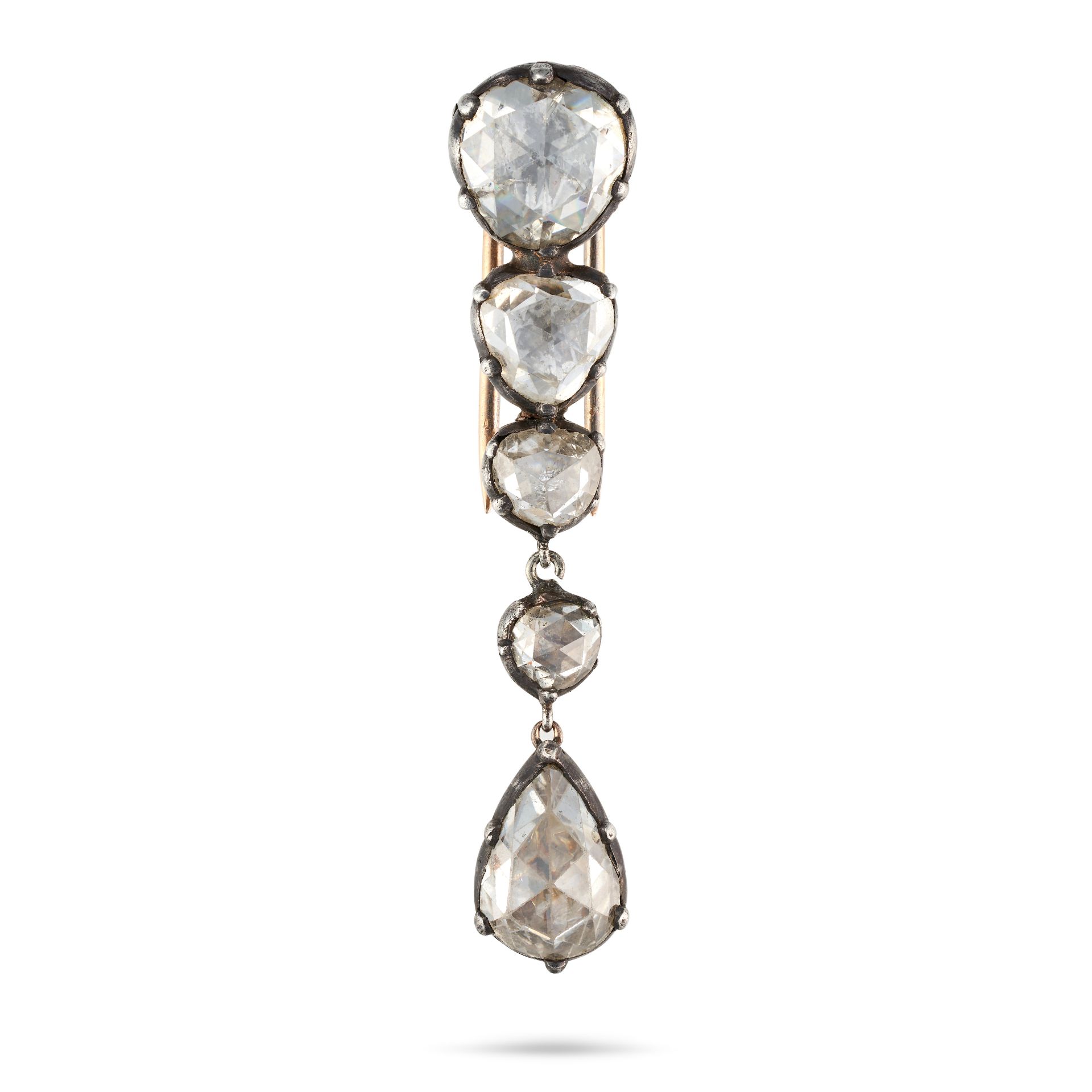 AN ANTIQUE DIAMOND CLIP BROOCH in yellow gold and silver, set with a row of four rose cut diamond...