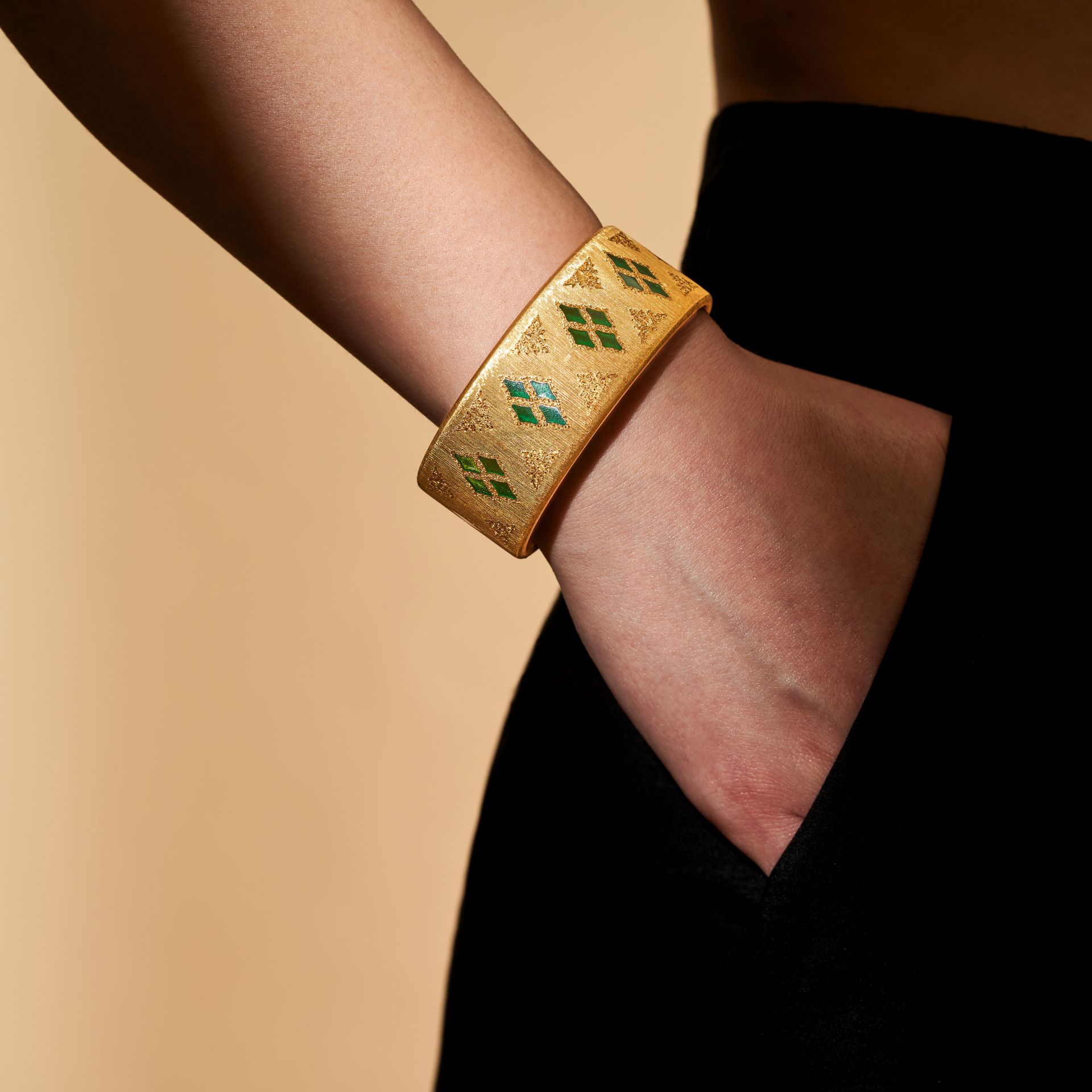 BUCCELLATI, AN ENAMEL BANGLE the open cuff hinged bangle inlaid with green plique a jour enamel, ... - Image 2 of 3