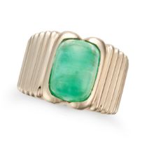 BOUCHERON, AN EMERALD RING in 18ct yellow gold, the fluted band set with a cabochon emerald, sign...