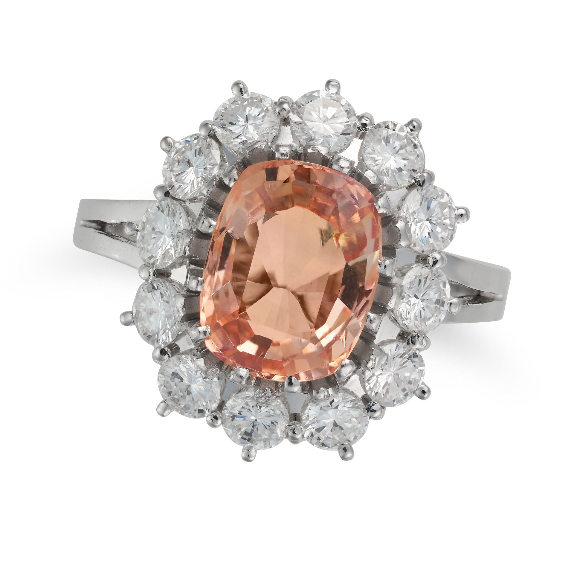 A 3.85 CARAT CEYLON NO HEAT PADPARADSCHA SAPPHIRE AND DIAMOND CLUSTER RING set with a cushion cut...