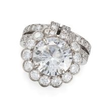 A 4.23 CARAT DIAMOND RING set with a round brilliant cut diamond of 4.23 carats in a border of ro...