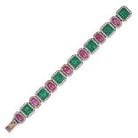 AN EMERALD, RUBY AND DIAMOND BRACELET set with a row of oval cabochon rubies and clusters of squa...
