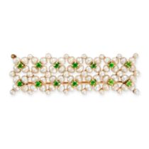 AN ANTIQUE PEARL AND DEMANTOID GARNET BROOCH in yellow gold, designed as a lattice of pearls, acc...