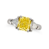 A TREATED YELLOW AND WHITE DIAMOND THREE STONE RING set with a radiant cut treated yellow diamond...