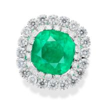 A COLOMBIAN EMERALD AND DIAMOND CLUSTER RING set with a cushion cut emerald of approximately 6.25...