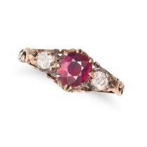 AN ANTIQUE RUBY AND DIAMOND THREE STONE RING in yellow gold, set with an oval cut ruby of approxi...