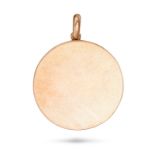 A GOLD LOCKET PENDANT in yellow gold, the circular pendant opening to reveal two glass covered lo...