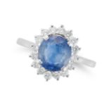 A SAPPHIRE AND DIAMOND CLUSTER RING set with an oval cut sapphire of approximately 2.23 carats in...
