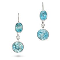 A PAIR OF BLUE ZIRCON AND DIAMOND DROP EARRINGS each comprising an oval cut blue zircon, suspendi...