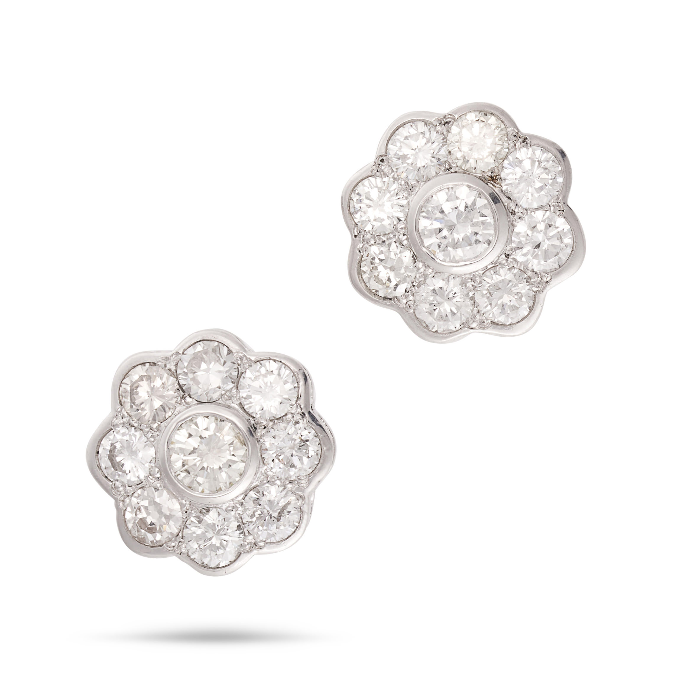 A PAIR OF DIAMOND CLUSTER EARRINGS each set with a cluster of round brilliant cut diamonds, the d...