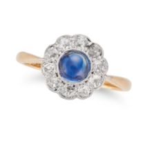 A SAPPHIRE AND DIAMOND CLUSTER RING in 18ct yellow gold and platinum, set with a round cabochon s...