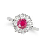 A RUBY AND DIAMOND CLUSTER RING set with a ruby of approximately 0.60 carats in a cluster of sing...