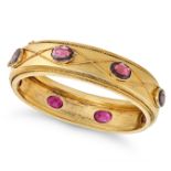 AN ANTIQUE GARNET BANGLE in yellow gold, set with oval cut garnets accented by twisted wirework d...