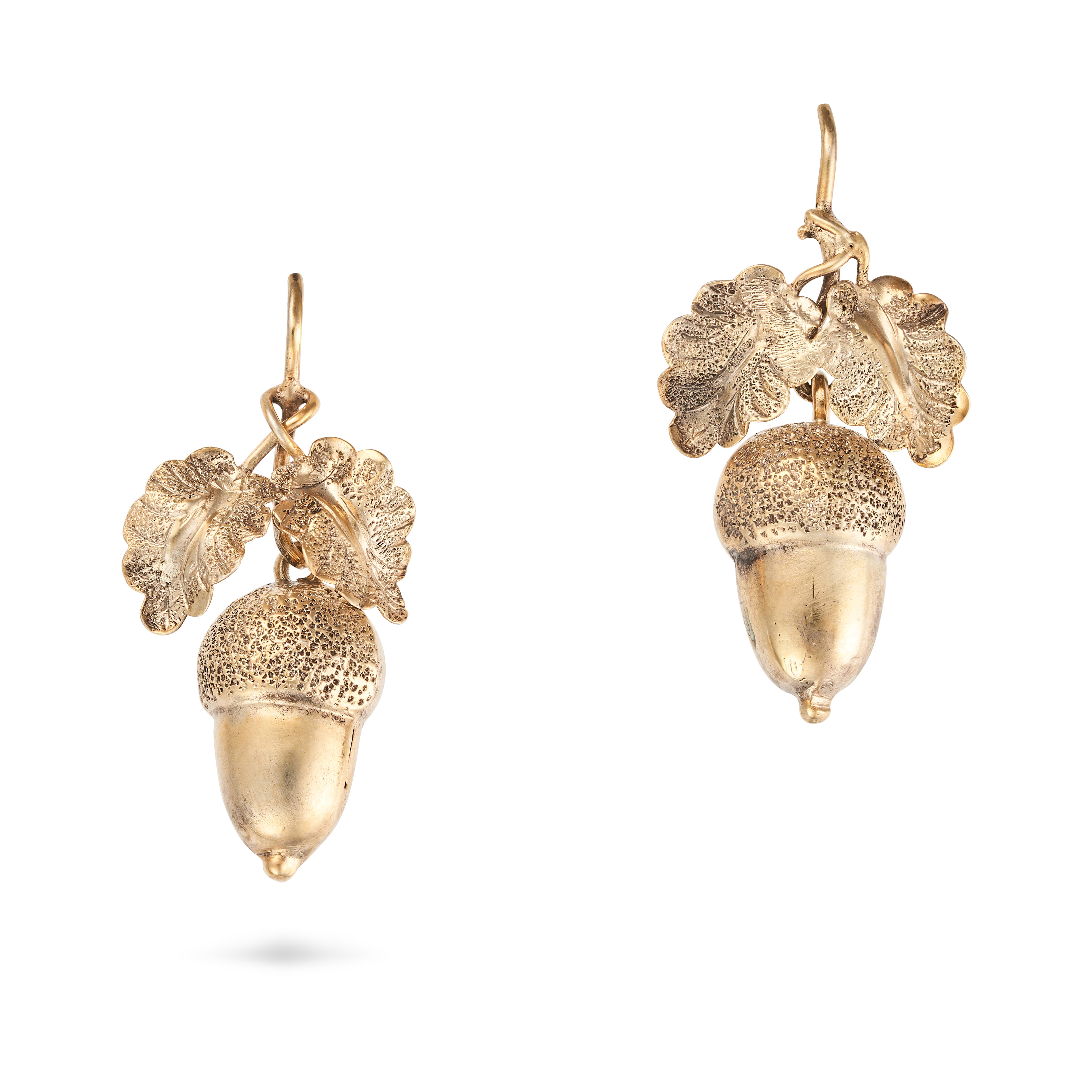 A PAIR OF ANTIQUE ACORN DROP EARRINGS in yellow gold, each designed as oak leaves suspending an a...