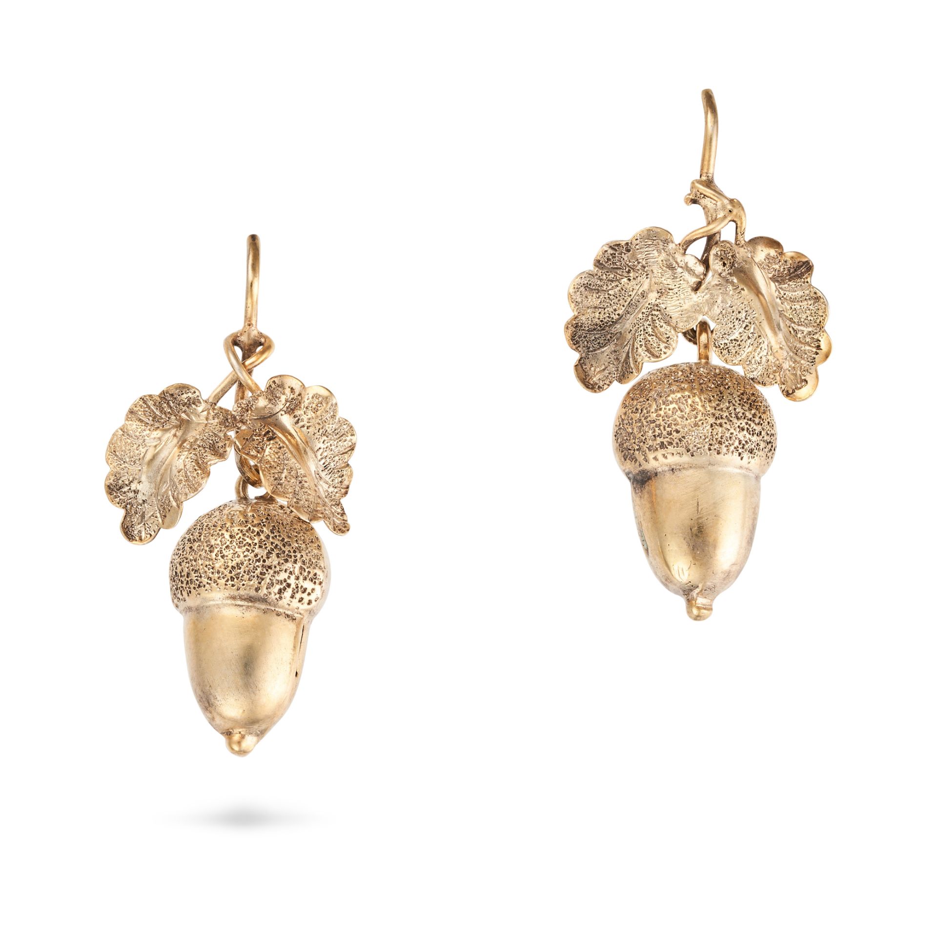 A PAIR OF ANTIQUE ACORN DROP EARRINGS in yellow gold, each designed as oak leaves suspending an a...