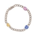 A SAPPHIRE CURB CHAIN BRACELET comprising a curb chain set with a cushion cut sapphire of approxi...