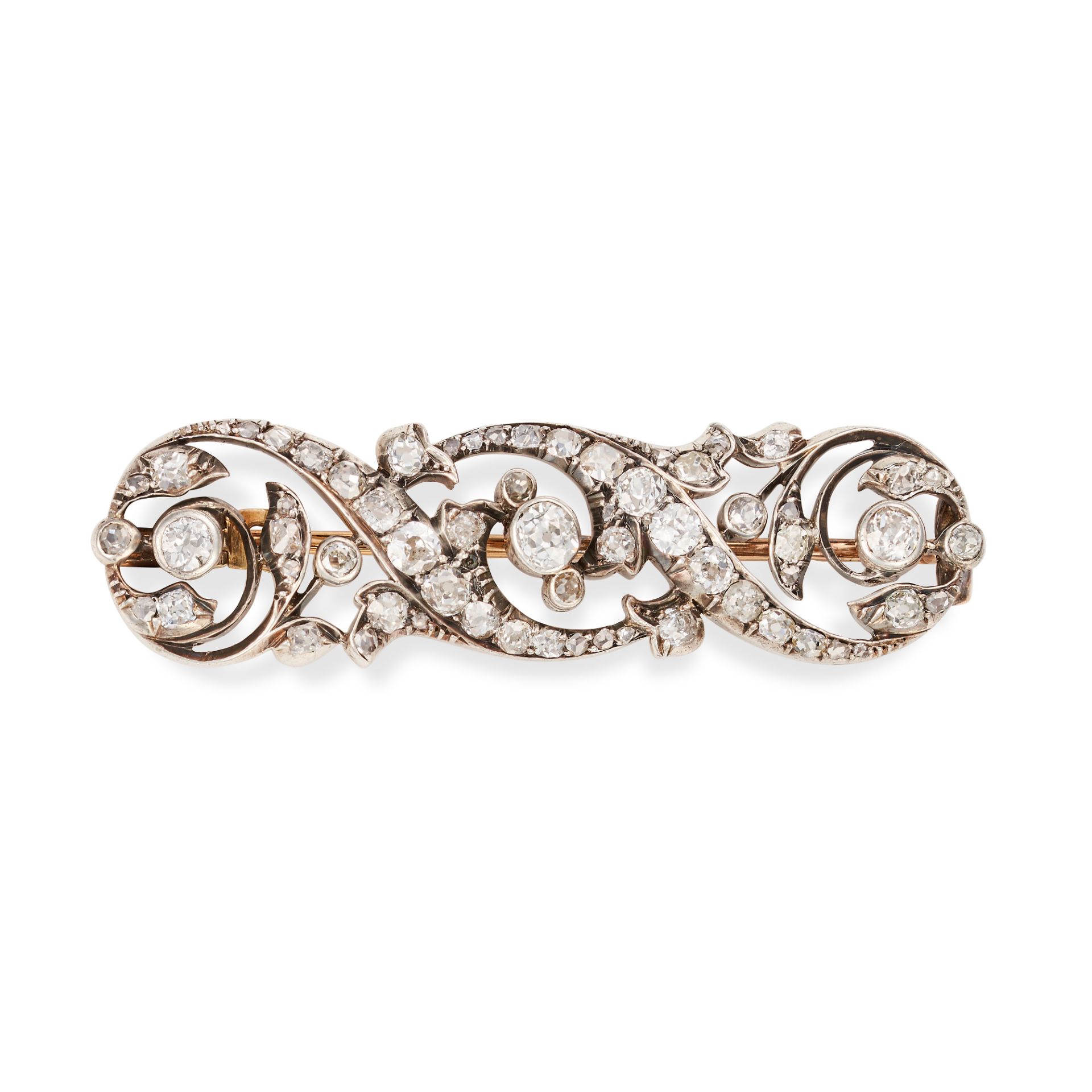 AN ANTIQUE FRENCH DIAMOND BROOCH in 18ct yellow gold and silver, the scrolling brooch set through...