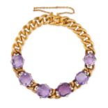AN ANTIQUE AMETHYST BRACELET in yellow gold, comprising a row of curb links set with six cushion ...