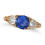 AN ANTIQUE SAPPHIRE AND DIAMOND THREE STONE RING in yellow gold, set with a round cut sapphire of...