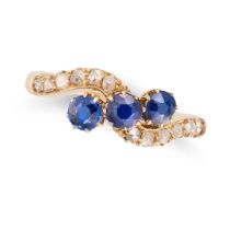 AN ANTIQUE SAPPHIRE AND DIAMOND RING in 18ct yellow gold, set with three round cut sapphires, the...