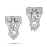 A PAIR OF DIAMOND CLIP BROOCHES in white gold and platinum, the sheild shaped clips set throughou...