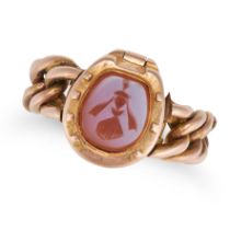 A CARNELIAN INTAGLIO POISON RING in 18ct yellow gold, set with a carnelian intaglio within a hors...