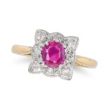 A RUBY AND DIAMOND CLUSTER RING set with a round cut ruby of approximately 0.69 carats in a clust...