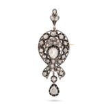 AN ANTIQUE DIAMOND PENDANT / BROOCH in yellow gold and silver, set with a principal pear shape ro...