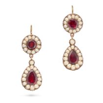 A PAIR OF ANTIQUE GARNET AND PEARL DROP EARRINGS each set with a round cut garnet in a border of ...